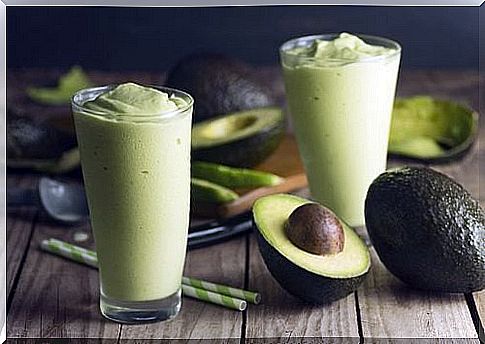 Two glasses filled with a shake for weight loss with green tea and avocado.