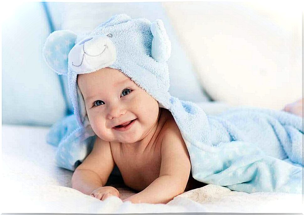 Baby clothes - baby with towel