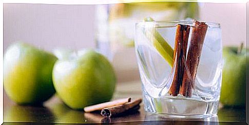 Cinnamon and apples in a glass
