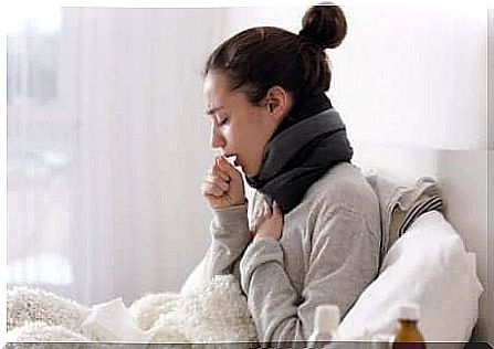 Woman with a cold in bed