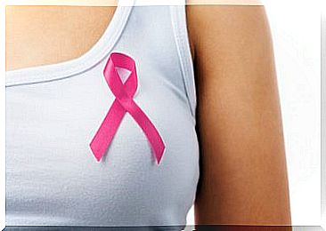 Woman with symbol against breast cancer