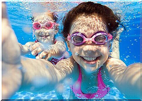 Children take selfie underwater