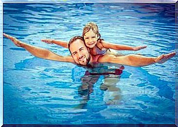 Father and daughter in the swimming pool