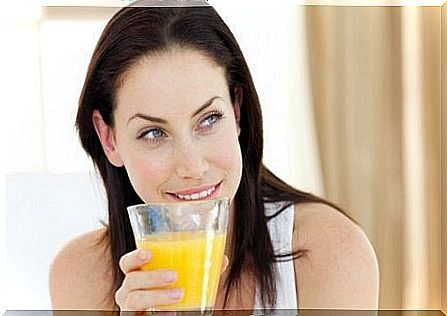 Woman drinking pineapple juice